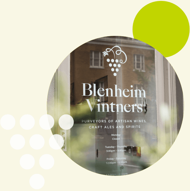 Blenheim Vintners store front with branding and contact information.